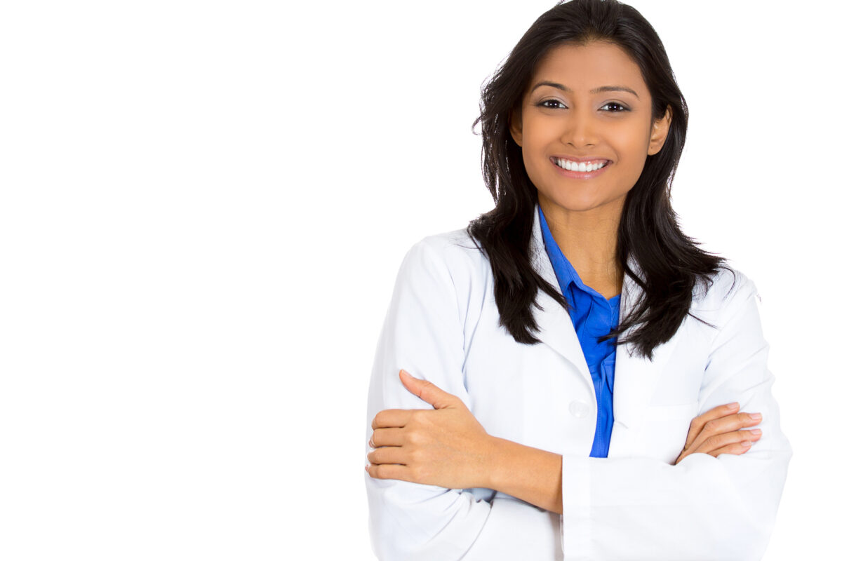 Portrait of a friendly smiling confident female, healthcare professional with lab coat, a doctor