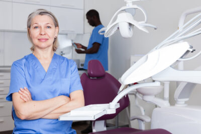 Portrait of dentist female and assistant in the workplace in clinic